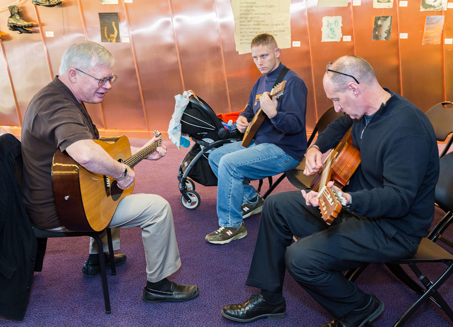 Glenn McCarthy teaching a guitar class for Veterans at the Hylton Performing Arts Center.