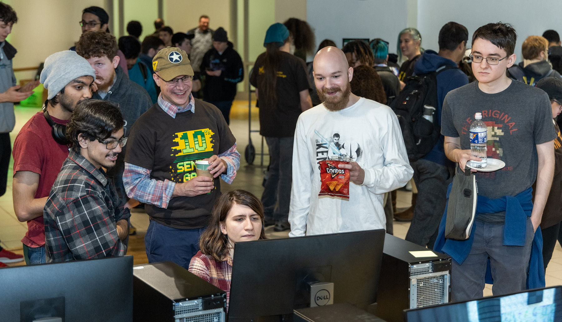 Students in Computer Game Design program attend the Senior Game Expo 2023, where senior students' games are played and demonstrated."