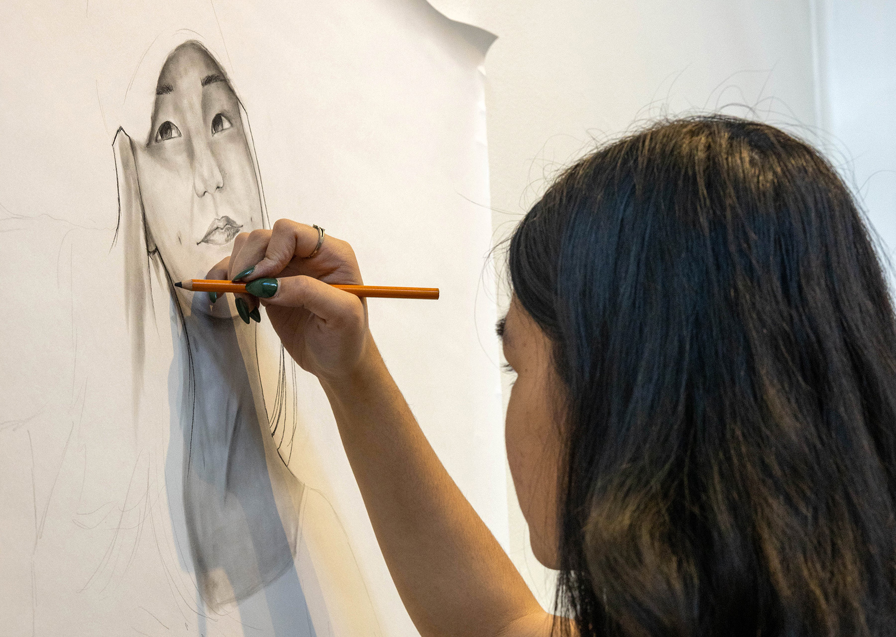 Mason School of Art student drawing a self portrait