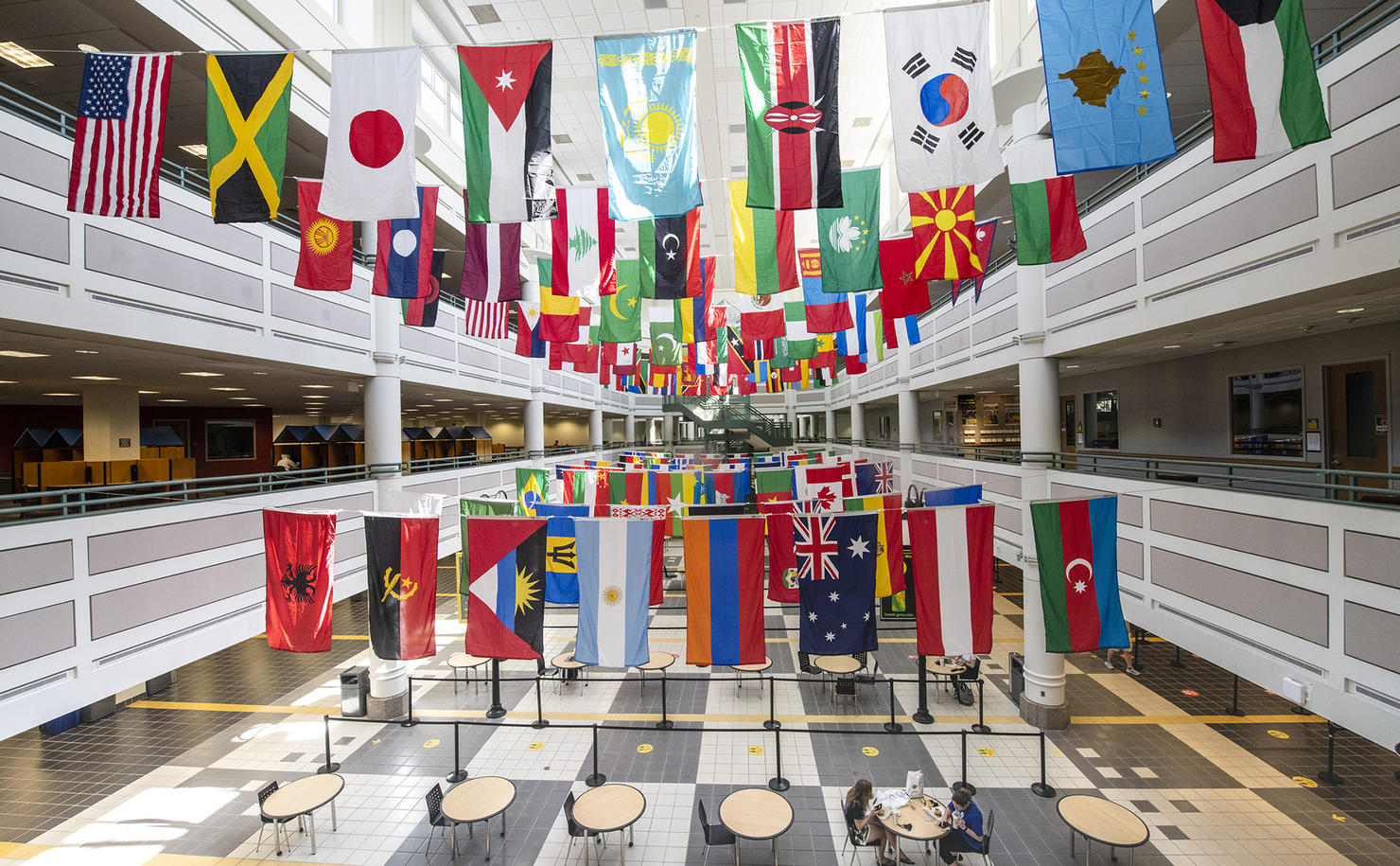 International flags hanging in the Johnson Center, Fairfax campus, celebrating international week at Mason.